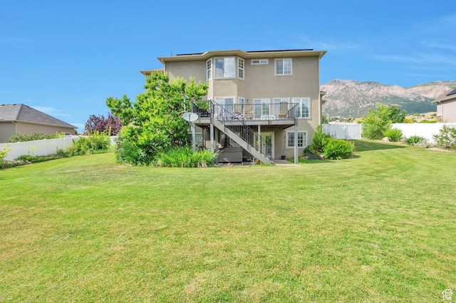 483 W 3500 N, Pleasant View, UT 84414 - back of house featuring stairway, a fenced backyard, stucco siding, and a deck with mountain view