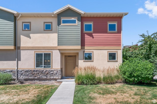 1012 W Willow Wind Dr, Farmington, UT 84025 - view of property with stucco siding, a front lawn, and stone siding