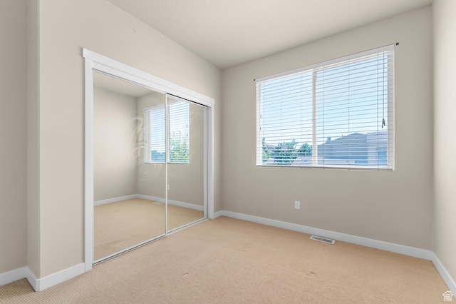 1012 W Willow Wind Dr, Farmington, UT 84025 - unfurnished bedroom featuring carpet flooring and a closet