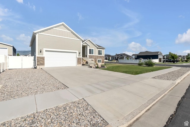 2460 N 2825 W, Plain City, UT 84404 - view of front facade featuring board and batten siding, a garage, concrete driveway, and a residential view