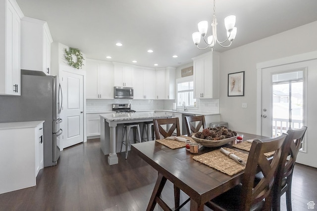 2460 N 2825 W, Plain City, UT 84404 - dining room featuring a chandelier, dark wood-style flooring, and recessed lighting