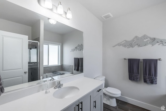 2460 N 2825 W, Plain City, UT 84404 - full bath with wood finished floors, a shower stall, vanity, and a garden tub