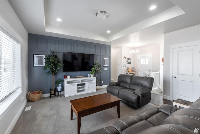 2460 N 2825 W, Plain City, UT 84404 - carpeted living area featuring a tray ceiling, a chandelier, and recessed lighting