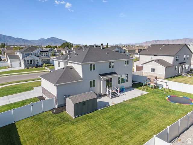 1346 W 1250 S, Springville, UT 84663 - back of house featuring a residential view, a storage unit, roof with shingles, and a fenced backyard