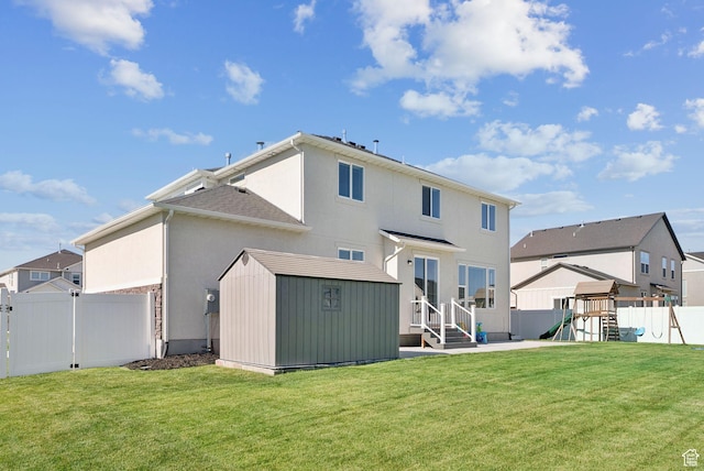 1346 W 1250 S, Springville, UT 84663 - back of house with a fenced backyard, a storage unit, a playground, stucco siding, and a residential view