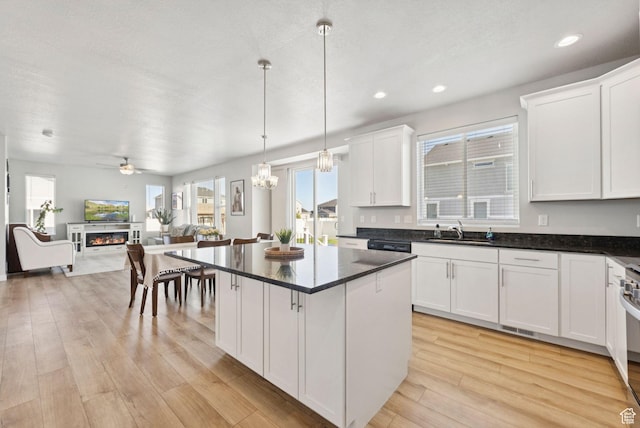 1346 W 1250 S, Springville, UT 84663 - kitchen with open floor plan, a ceiling fan, white cabinetry, light wood-style flooring, and healthy amount of natural light