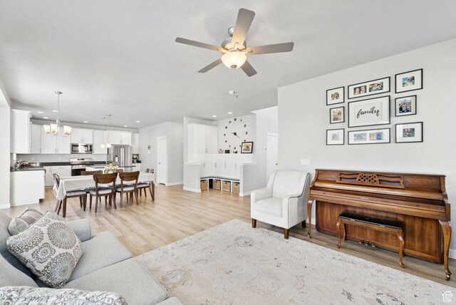 1346 W 1250 S, Springville, UT 84663 - living area with a chandelier, ceiling fan, light wood-style floors, and recessed lighting