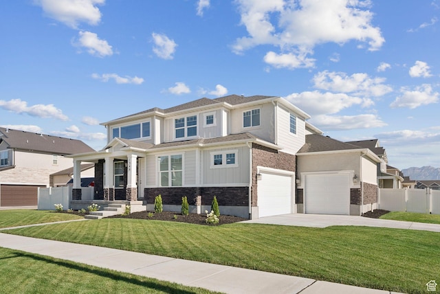 1346 W 1250 S, Springville, UT 84663 - view of front of home featuring stone siding, driveway, board and batten siding, and an attached garage
