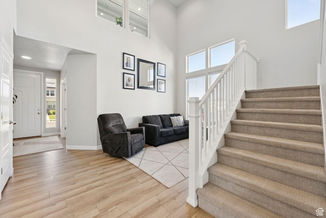 1346 W 1250 S, Springville, UT 84663 - entrance foyer with stairs, a towering ceiling, light wood finished floors, and plenty of natural light