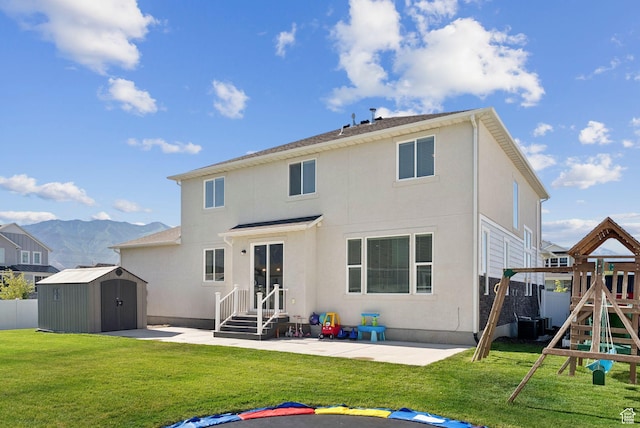 1346 W 1250 S, Springville, UT 84663 - back of property with a shed, a patio area, a playground, and stucco siding