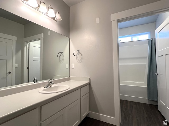 14652 S Astin Ln Unit U102, Herriman, UT 84096 - full bath featuring wood finished floors, vanity, and shower / bath combination with curtain