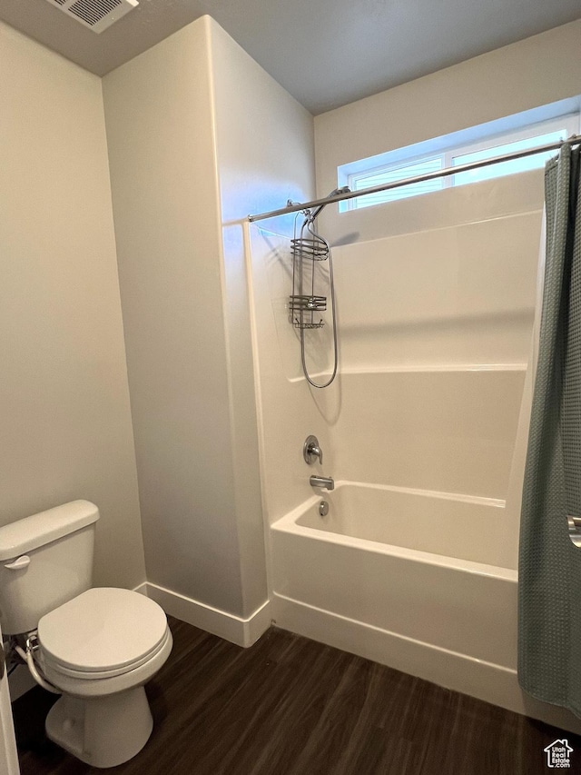 14652 S Astin Ln Unit U102, Herriman, UT 84096 - full bathroom featuring shower / tub combo with curtain and wood finished floors