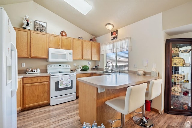 2132 W 2175 N, Clinton, UT 84015 - kitchen with white appliances, a peninsula, lofted ceiling, light wood-type flooring, and a kitchen breakfast bar