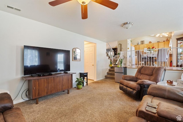 2132 W 2175 N, Clinton, UT 84015 - living room with light carpet, stairway, a ceiling fan, and plenty of natural light