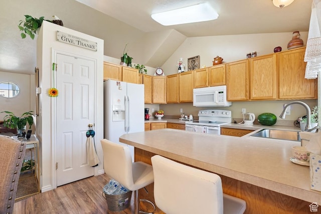 2132 W 2175 N, Clinton, UT 84015 - kitchen featuring white appliances, lofted ceiling, a peninsula, light countertops, and light wood-style flooring