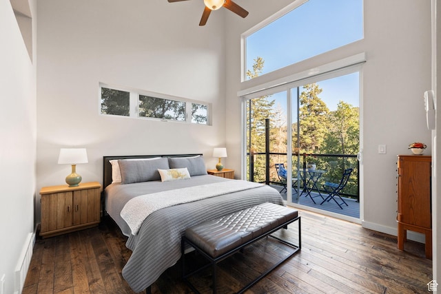 249 S Parkview Dr E, Park City, UT 84098 - bedroom featuring a high ceiling, access to outside, wood-type flooring, a ceiling fan, and a baseboard heating unit