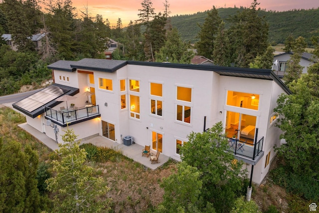 249 S Parkview Dr E, Park City, UT 84098 - back of house with a balcony, a patio, and stucco siding