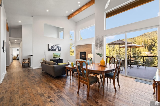 249 S Parkview Dr E, Park City, UT 84098 - dining area featuring wood-type flooring, a glass covered fireplace, high vaulted ceiling, beamed ceiling, and recessed lighting
