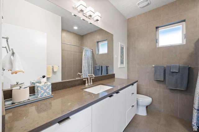 249 S Parkview Dr E, Park City, UT 84098 - bathroom featuring vanity, tile walls, tile patterned flooring, tiled shower, and plenty of natural light