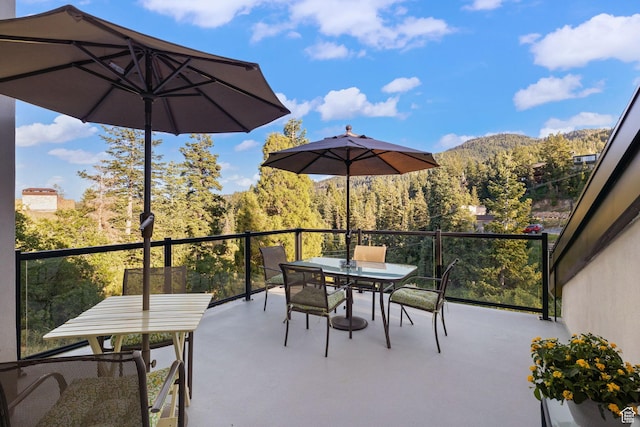 249 S Parkview Dr E, Park City, UT 84098 - view of patio featuring outdoor dining space, a view of trees, and a mountain view