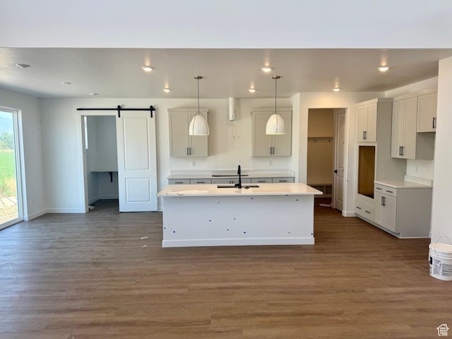 1001 E 250 S, Salem, UT 84653 - kitchen with a kitchen island with sink, dark wood finished floors, a barn door, open floor plan, and recessed lighting