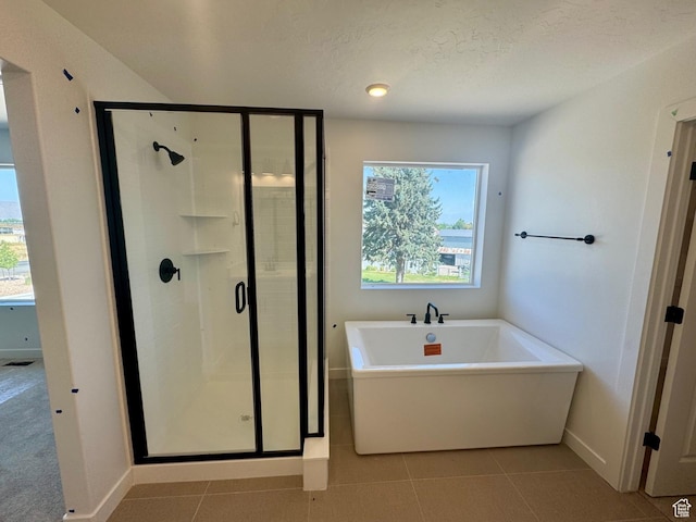 1001 E 250 S, Salem, UT 84653 - full bathroom with a freestanding tub, a stall shower, and tile patterned flooring