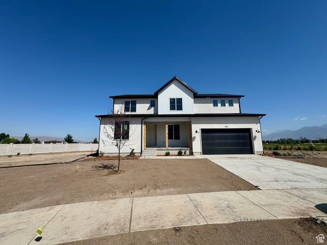 1001 E 250 S, Salem, UT 84653 - modern farmhouse style home featuring driveway, an attached garage, covered porch, and a mountain view