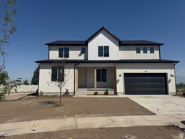 1001 E 250 S, Salem, UT 84653 - modern inspired farmhouse featuring an attached garage, driveway, covered porch, and stucco siding