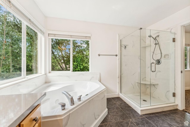 631 E Clearwater Dr, Layton, UT 84041 - bathroom featuring a marble finish shower, healthy amount of natural light, a bath, and tile patterned floors