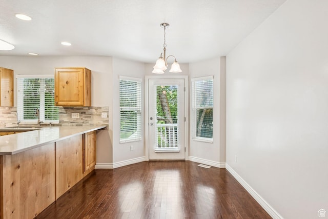 631 E Clearwater Dr, Layton, UT 84041 - kitchen featuring light brown cabinets, light countertops, backsplash, dark wood-style floors, and hanging light fixtures