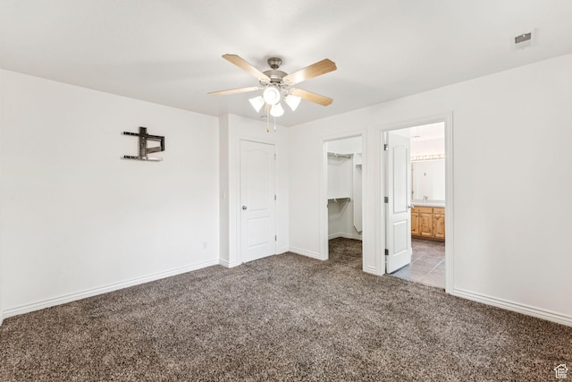 631 E Clearwater Dr, Layton, UT 84041 - unfurnished bedroom featuring light colored carpet, a spacious closet, a ceiling fan, and ensuite bathroom