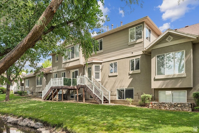 631 E Clearwater Dr, Layton, UT 84041 - back of house with stairway, stucco siding, a yard, and a deck