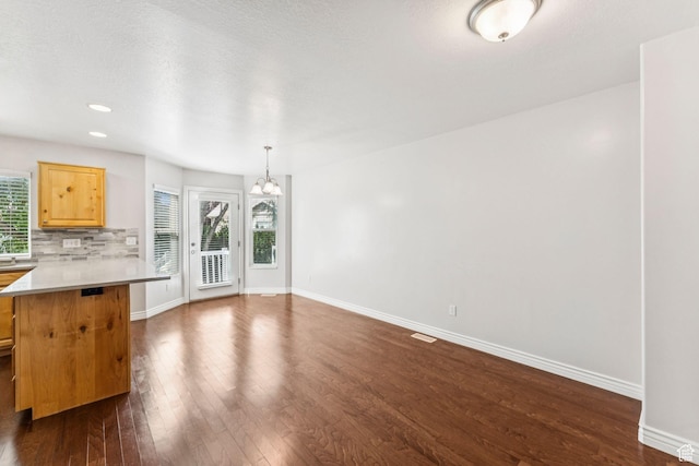 631 E Clearwater Dr, Layton, UT 84041 - unfurnished living room with a chandelier, dark wood-style floors, and recessed lighting