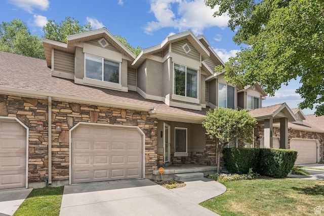 631 E Clearwater Dr, Layton, UT 84041 - view of front facade featuring stone siding, covered porch, a shingled roof, and stucco siding