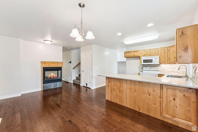 631 E Clearwater Dr, Layton, UT 84041 - kitchen featuring white appliances, light brown cabinets, light countertops, a peninsula, and dark wood-style flooring