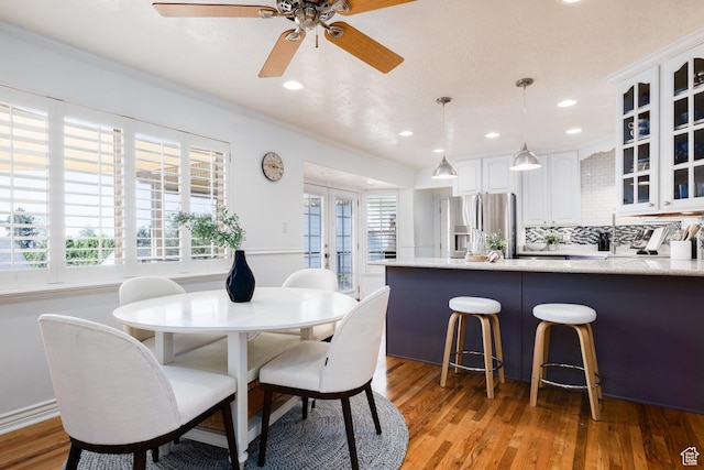 2400 E Logan Way S, Salt Lake City, UT 84108 - dining room featuring light wood-style floors, a ceiling fan, recessed lighting, and crown molding