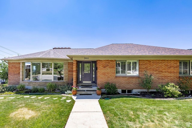 2400 E Logan Way S, Salt Lake City, UT 84108 - view of front of property with a front yard, brick siding, and a shingled roof