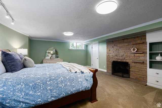 2400 E Logan Way S, Salt Lake City, UT 84108 - bedroom featuring carpet, ornamental molding, a textured ceiling, a stone fireplace, and track lighting