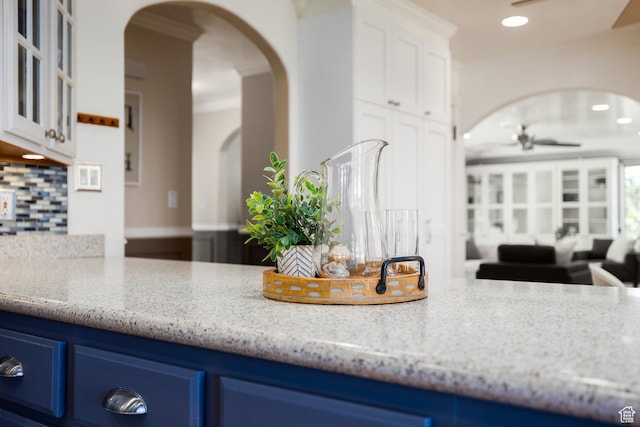 2400 E Logan Way S, Salt Lake City, UT 84108 - kitchen featuring arched walkways, blue cabinetry, a ceiling fan, backsplash, and recessed lighting