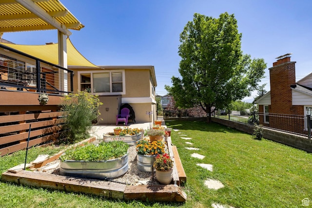 2400 E Logan Way S, Salt Lake City, UT 84108 - view of yard featuring a vegetable garden and a pergola