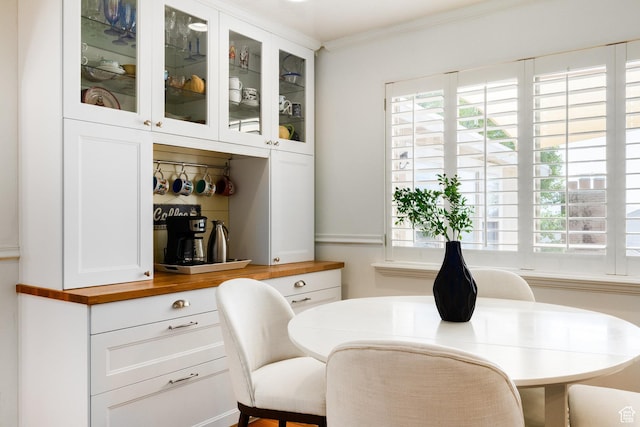 2400 E Logan Way S, Salt Lake City, UT 84108 - dining area with healthy amount of natural light and ornamental molding
