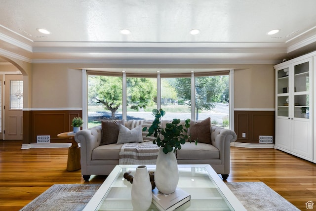 2400 E Logan Way S, Salt Lake City, UT 84108 - living area with a decorative wall, crown molding, wainscoting, arched walkways, and healthy amount of natural light