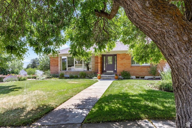 2400 E Logan Way S, Salt Lake City, UT 84108 - view of front facade with brick siding, a front yard, and a shingled roof