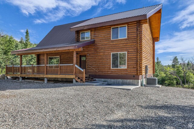 14961 N 12740 E, Mount Pleasant, UT 84647 - log-style house featuring log siding, covered porch, and a metal roof