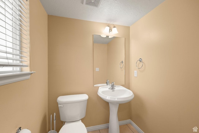 1339 Alpine Way, Provo, UT 84606 - half bathroom featuring a textured ceiling and tile patterned flooring
