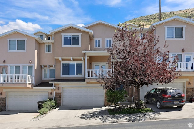 1339 Alpine Way, Provo, UT 84606 - townhome / multi-family property featuring an attached garage, stucco siding, and driveway