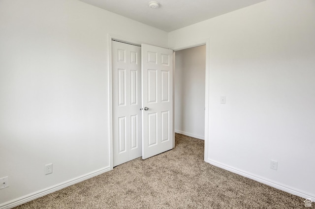 8048 W Copperfield Pl # 31, Magna, UT 84044 - unfurnished bedroom featuring light carpet and a closet