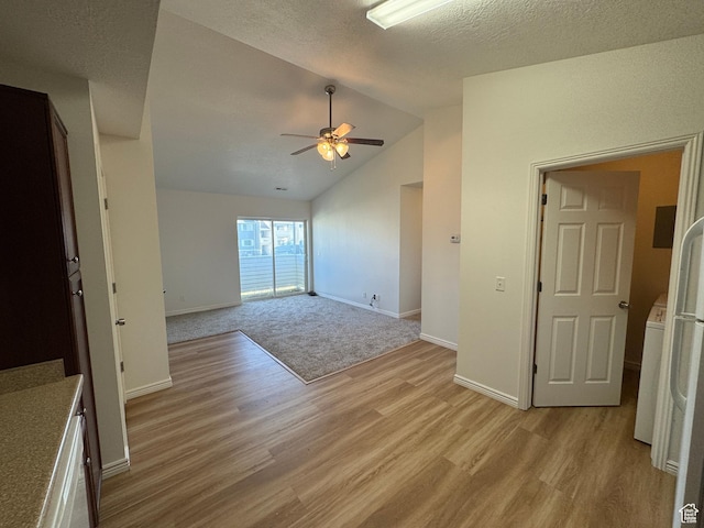 8048 W Copperfield Pl # 31, Magna, UT 84044 - unfurnished room with light wood-type flooring, ceiling fan, lofted ceiling, and a textured ceiling
