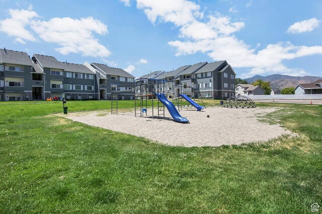 8048 W Copperfield Pl # 31, Magna, UT 84044 - community play area featuring a residential view, a yard, and a mountain view