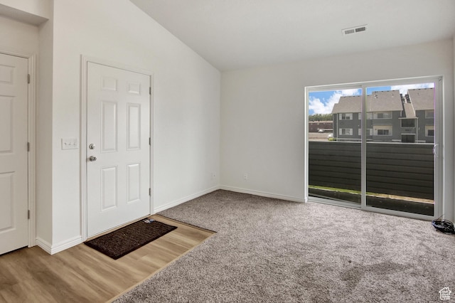 8048 W Copperfield Pl # 31, Magna, UT 84044 - entrance foyer with vaulted ceiling, carpet, and wood finished floors